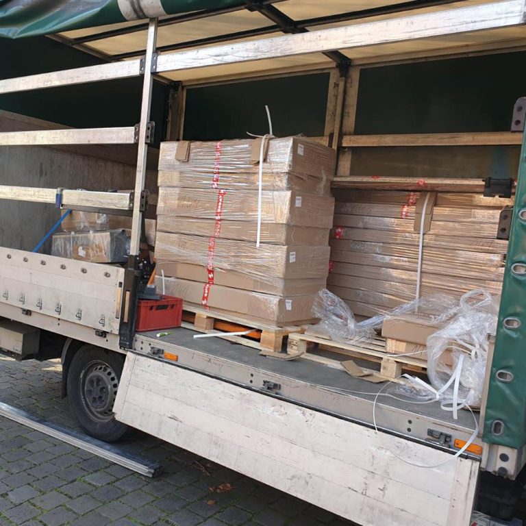 Packages with exhibition stand components before unloading on the truck