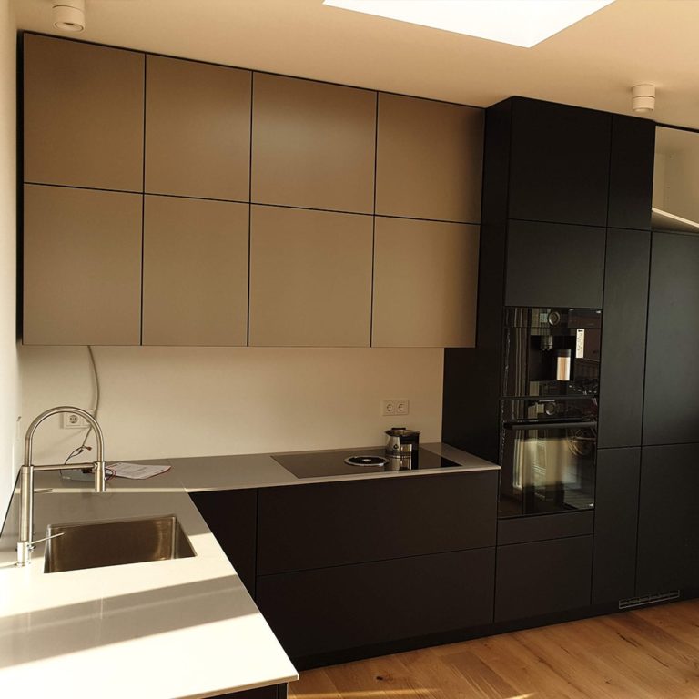 a purist kitchen in dark and light gray with completely smooth fronts