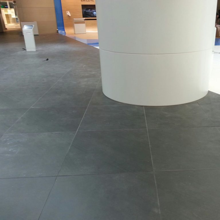 Gray floor tiles laid in an exhibition stand