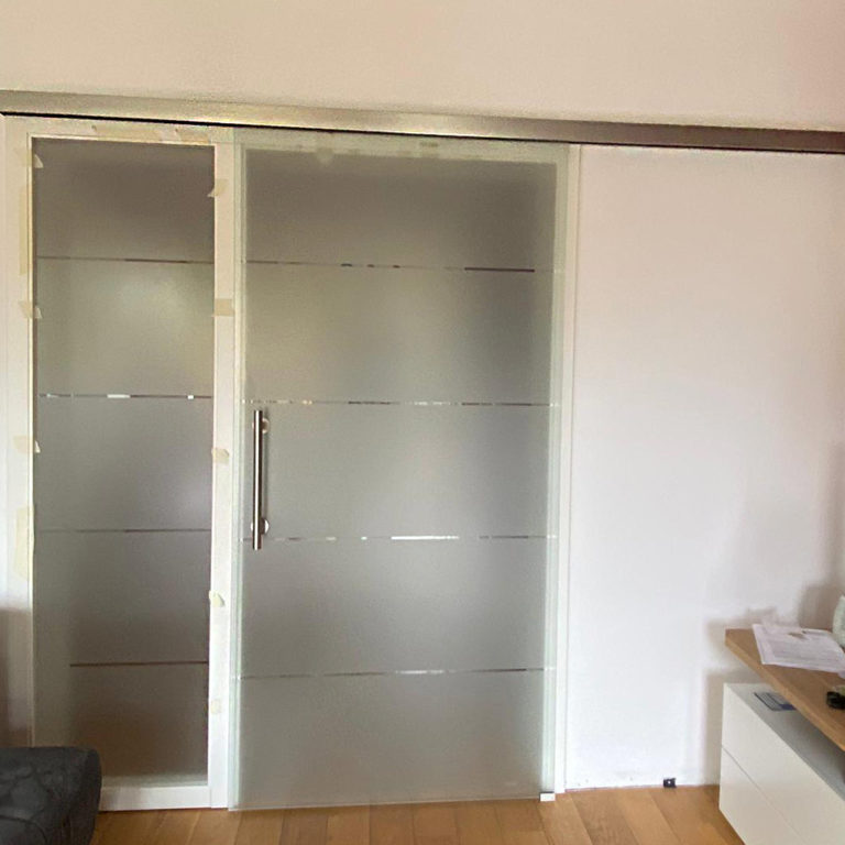 a closed sliding frosted glass door