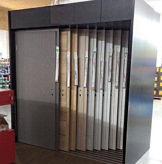 A store in store system for displaying door variants in a large dark wooden corpus